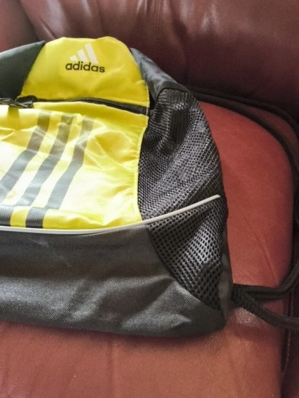 Adidas Black and Yellow Drawstring Backpack with Front Zip Pocket